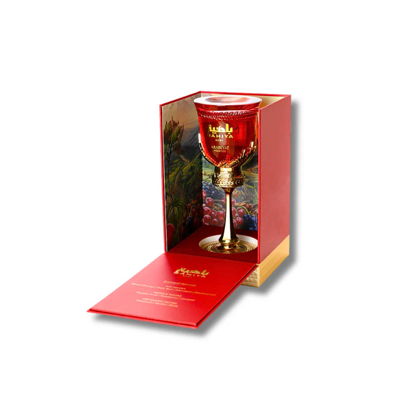 Bahiya Ruby perfume box with gold and red tropical leaf design, luxury packaging