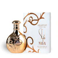 Arabiyat Nyla EDP for Women 2.7 oz in gold ornate bottle with matching white and gold box, a fruity floral fragrance with jasmine and coconut.