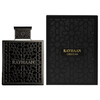 Rayhaan Obsidian Eau de Parfum for Men shown with its ornate bottle and matching luxury box, blending iris, leather, and wood for a bold scent.