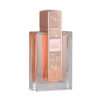 Lattafa Angham fragrance bottle with pink accents