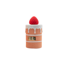 Arabiyat Sugar Strawberry Tres Leches Eau de Parfum bottle shaped like a layered cake with white icing and a strawberry top. 3.4 fl.oz sweet scent.